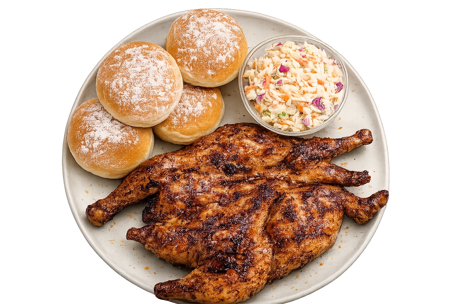 A flame-grilled half chicken on a plate with four soft rolls and a bowl of coleslaw.