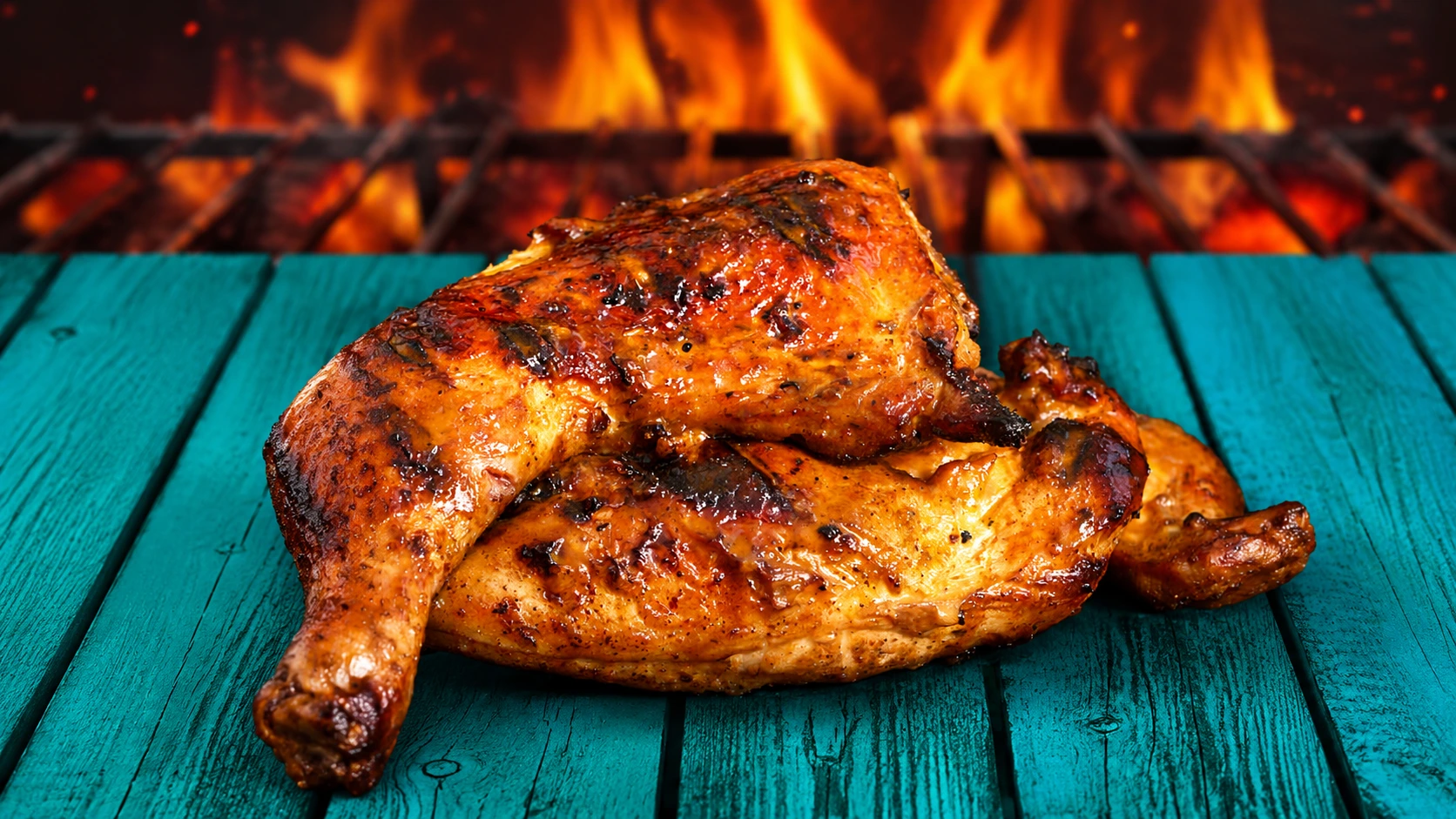 Half a flame-grilled chicken with charred skin.